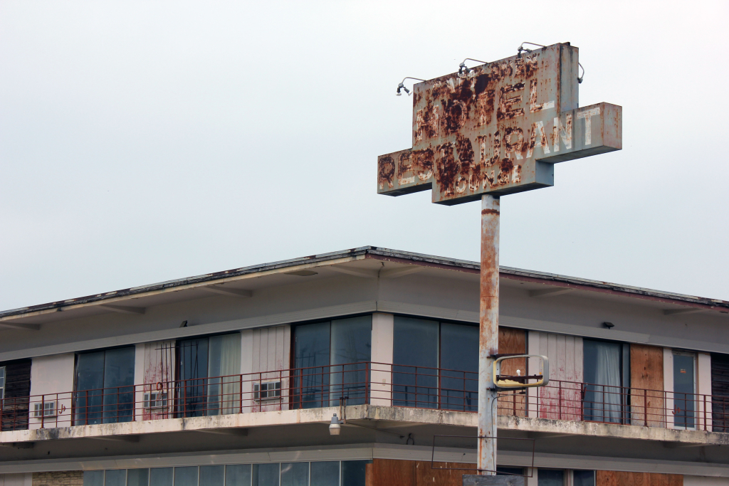 This empty hotel's sign is rusted out, but it's still standing.Mose Buchele